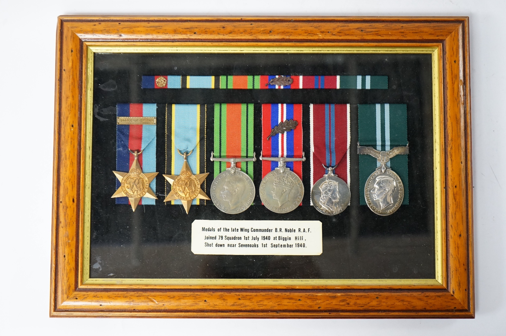 A framed WWII RAF medal group awarded to Wing Commander Brian Robert Noble, comprising;, The 1939-1945 Star, with clasp for the Battle of Britain, The Air Crew Europe Star, The Defence Medal, The British War Medal, The 1